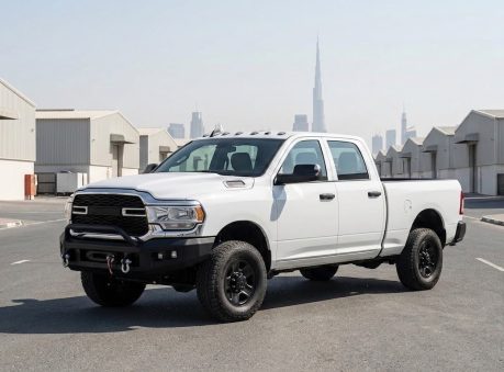pickup truck used for construction site logistics and equipment support, parked at a clean industrial site in dubai